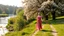 Placeholder: country side ,river side ,bloosoming trees and flowers ,beautifull lady gracefully walking