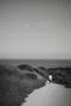 Placeholder: walking along a path that winds towards the top of a mountain, it is summer, the sea in the background photography taken with a Leica camera and 50mm lens, real photography in black and white, nostalgia