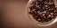 Placeholder: cinematic shot of coffee beans inside a glass bowl, glass, crystal, dewdrops, warm lighting, soft lighting, sunbeam, linen