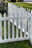 Placeholder: white vinyl fence in yard, photograph