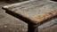 Placeholder: a detail of a very worn school desk