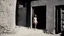 Placeholder: [colour helmut newton 1960’s stop-motion animation style the small Jesus house near Bethlehem] a 70s advertisement video TV featuring In the corner, a figure emerges from the shadows. It's Maria Magdalena in agent provocateur, her eyes gleaming with a mixture of allure and danger. She moves towards you with a grace that captivates your every sense, drawing you in like a moth to a flame as a claymation character toy from a claymation horror movie in burning rainbow land, from hell, creepy Videos