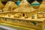 Placeholder: A tan sandbox with a sphinx and pyramid temples designed in ancient Egyptian architectures and sculptures painted by Gustav Klimt