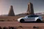 Placeholder: A Tesla 'Model Y' is going at a high speed, near the 'Devils Tower' in Wyoming. (CINEMATIC, WIDE ANGLE LENS, PHOTO REAL)