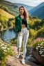 Placeholder: fullbody shot of young-beautiful-girl-with-a-perfect-face-with-make-up-wearing- sport pants and jacket standing ,geen hills ,nice nature environment ,wild flowers,clean water river with colorfull rocks in floor