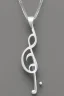 Placeholder: White gold necklace in the shape of a music note underneath Contains white crystal