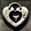 Placeholder: grey and black stone heart-shaped, with antique keyhole inside, on white background