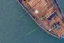 Placeholder: Aerial view of wooden ship listing, flir camera, night vision, helicopter view, drone pov, night, ship sinking