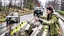 Placeholder: upset lady points handgun at deer carcass on the highway