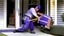 Placeholder: fedex driver with a chainsaw at the front door