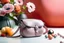 Placeholder: top shot of a purse on a pink table with flowers, gray spheres in the background, product photography in style of Kodak Portra — style raw — q 2 — s 250 — v 5.2 — ar 9:16