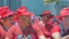 Placeholder: many men wearing red trucker hats enjoy the pride parade floats