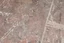 Placeholder: scratched concrete floor, low angle