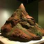 Placeholder: A brown mountain made out of clay painted by Paul Gauguin