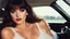 Placeholder: [artistic photo by Tony Kent (1980)] a brunette in a car bends over to look at the camera, she is going to a party, she has a cigarette