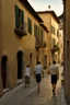 Placeholder: A realistic photo of a small Toscany town in late spring, a pair of inamorato young people on the street, early evening, last shines of sun in Henri Cartier-Bresson style