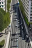 Placeholder: birds eye view of a street with one way traffic, a cycle lane and a path