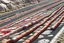 Placeholder: A reddish gray highway with speeding cars designed in Ica stones painted by MC Escher