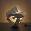 Placeholder: table lamp inspired by organic shape building