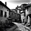 Placeholder: Black and white photograph of a small Italian medieval village, photo taken in year 1278