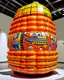 Placeholder: An orange colored coliseum with boxing gloves designed in Matryoshka dolls painted by Roy Lichtenstein