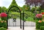 Placeholder: intricate ornate gate, garden, path, flowers