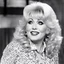 Placeholder: youthful Dolly Parton singing her famous "God/Deicide" tube