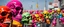 Placeholder: a field of skulls, multi colored, bright, vivid, psychedelic, high detailed, high gloss, insanely detailed, matte, horrorcore, lining the street, unsettling contrast, monument to death, grim reaper parade