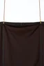 Placeholder: darker textured hanging fabric background stretched between decorative brass strips attached at top and bottom