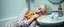 Placeholder: drunk albino woman with a hot dog in bread sleeping over in bathroom