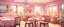 Placeholder: Background: interior of a dining room in a cozy bed and breakfast restaurant during a Sunday morning brunch with pale pink walls. 3D vector cartoon asset, mobile game cartoon stylized, clean. Details: springtime, hutch, detailed. Camera: side angle, 90°, 35 mm. Lighting: warm sunbeams, sparkles and bloom, LED lights. cartoon style