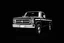 Placeholder: 1970s Chevrolet square body truck facing a little to the left, black background, high contrast black and white vector