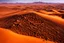 Placeholder: grand chocolate mountain very melting in the sahara, hot, suny day, photograpy