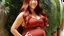 Placeholder: Gina Rodriguez fully transformed into Heavily pregnant German teenager, Long red hair, Maternity gown, Comfortable, elegance, Teenage motherhood, Radiant glow Maternal resilience Motherly grace 100% transformed Youthful vitality Maternal beauty Rounded belly Fiery red tresses Maternity attire perfection Motherly aura Waist: 28 inches Hips: 38 inches Bust: 34 inches Transformation completion Bathwater radiance Unexpected beauty