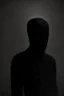 Placeholder: Background is dark grey, almost black. There is a head and torso silhouette looming in the picture, completely masked by a black spongy suit.