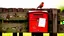 Placeholder: an old wooden fence, a bird on the top, a red old mailbox on the fence, a big note stuck on the mailbox