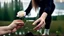 Placeholder: a young woman's hand plants a small white rose stem in the ground, in the background a lake, some green trees, ultra detailed, sharp focus, perfect hands, perfect photo