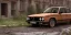 Placeholder: an abandoned 1990 bmw rust 2-door overgrown by nature with dust ,ultra realistic,concept, 4k ,on street,8k resolution, high-quality, fine-detail, parked in crowded city winter