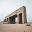 Placeholder: Fotografia di un grande ponte moderno brutalista, che sembra un tugurio, parzialmente sommerso. La struttura è erosa e inglobata dal paesaggio naturale, come se il tempo o l'ambiente avessero iniziato a "riassorbirla". L'atmosfera è desolata e surreale, con un ambiente circostante spoglio e sabbioso hasselblad h6d400c --ar 85:128 --v 6.0