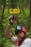 Placeholder: Red vested TF2 engineer with yellow hardhat taking a selfie at the forest