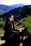 Placeholder: Diamanda Galas playing piano on a hillside