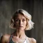 Placeholder: beautiful young woman, short grey metallic triathlon swimsuit, short blond wavy bob hair, blurred concrete background