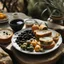 Placeholder: A plate of olives, surrounded by a breakfast of cheese and bread, and a cup of hot tea found in nature