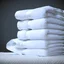 Placeholder: super realistic photo of a stack of towels on a white background