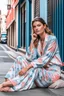 Placeholder: a supermodel in designer sleepwear sitting on street for magazine cover photoshoot