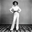Placeholder: a standing revealing full body black and white photoshoot Princess Leia with her Star Puffs hairstyle by Helmut Newton, typical for the provocative style of Newton
