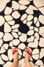 Placeholder: perfect picture of a woman's 5 toes with marble floor as background and red nail polish