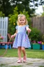 Placeholder: a pretty 5 years old girl with blue eyes and nice dress and shoes skipping rope in children play garden