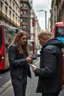 Placeholder: A stalker wants an autograph from a long-haired rock musician on a street in central London. The stalker is an overweight soon bald 25-year-old and looks a bit slimy, the atmosphere is oppressive and unpleasant, lot of traffic and london busses, hectic hour, a nice hotel
