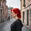 Placeholder: a girl with bright red hair, looking over her shoulder, walking along a bust street